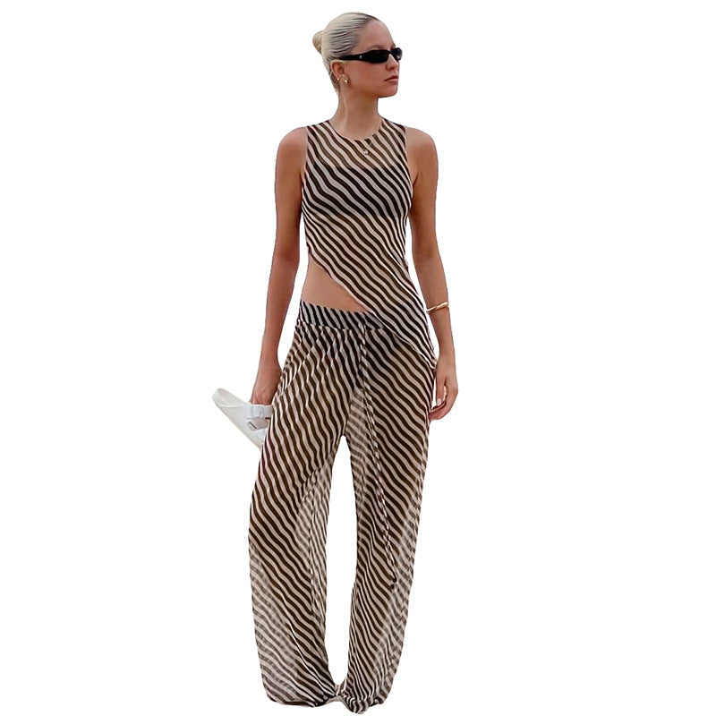 Dame stilfuld jumpsuit med asymmetrisk snit og stribemønster Stilla