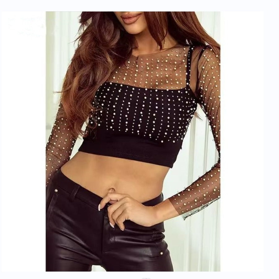 Dame elegant bodysuit med transparente ærmer og glitrende detaljer Stilla