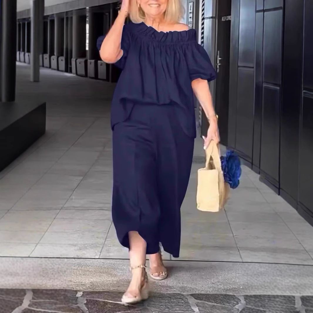 Dame luftig jumpsuit-sæt med voluminøse ærmer og raffineret taljering Stilla