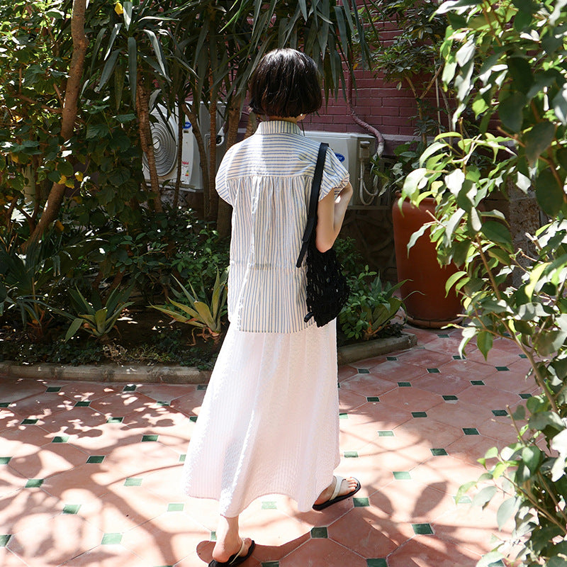 Dame afslappet bluse med elegant taljering og fine knapdetaljer Stilla