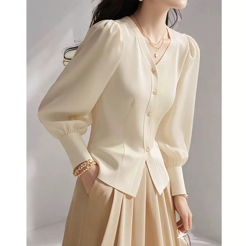 Dame elegant bluse med puffærmer og knapdetaljer Stilla