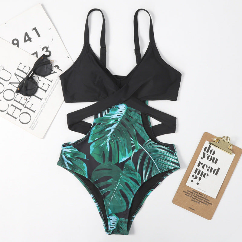 Dame jumpsuit-badedragt med floral udskæring og moderigtigt kryds-design Stilla