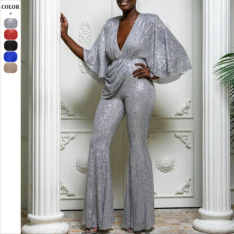 Dame glamourøs jumpsuit med glitrende paletter og vidde ben Stilla