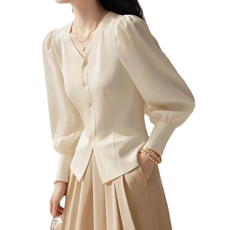 Dame elegant bluse med puffærmer og knapdetaljer Stilla