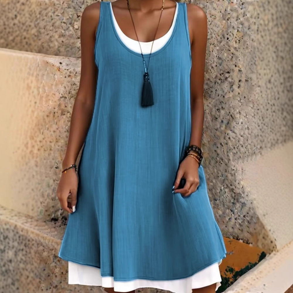 Dame afslappet lag-kjole med dyb rund halsudskæring og praktiske sidelommer Stilla