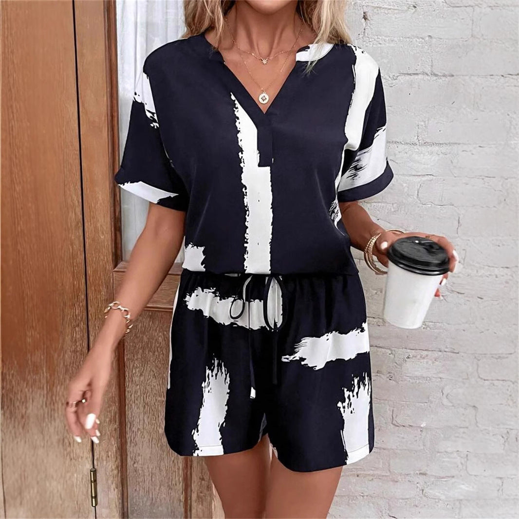 Damer kortærmet jumpsuit med moderne grafiktryk Stilla