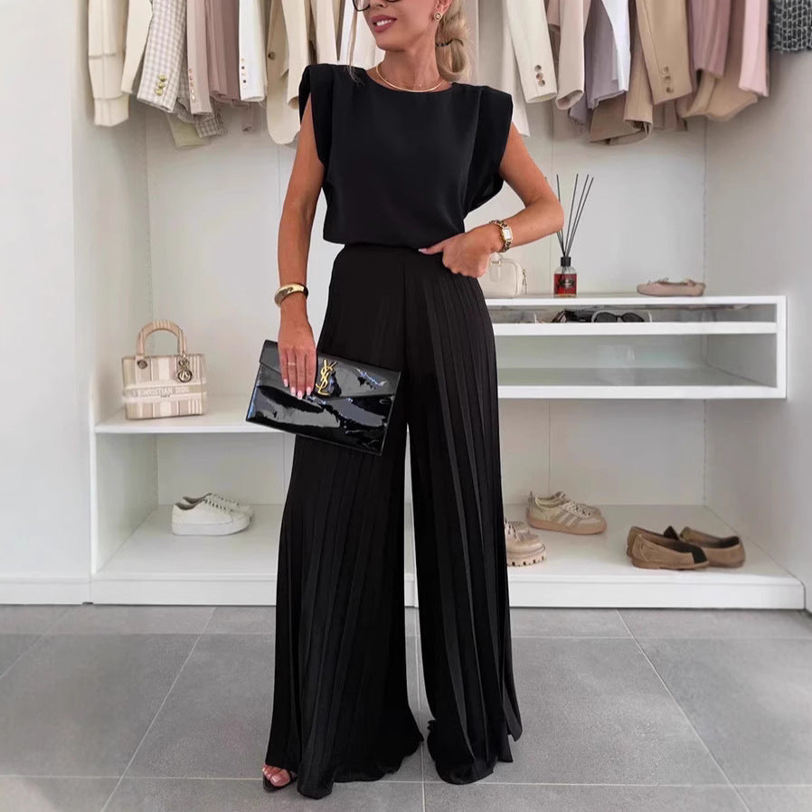 Dame jumpsuit med flydende blomsterprint og elegant talje Stilla
