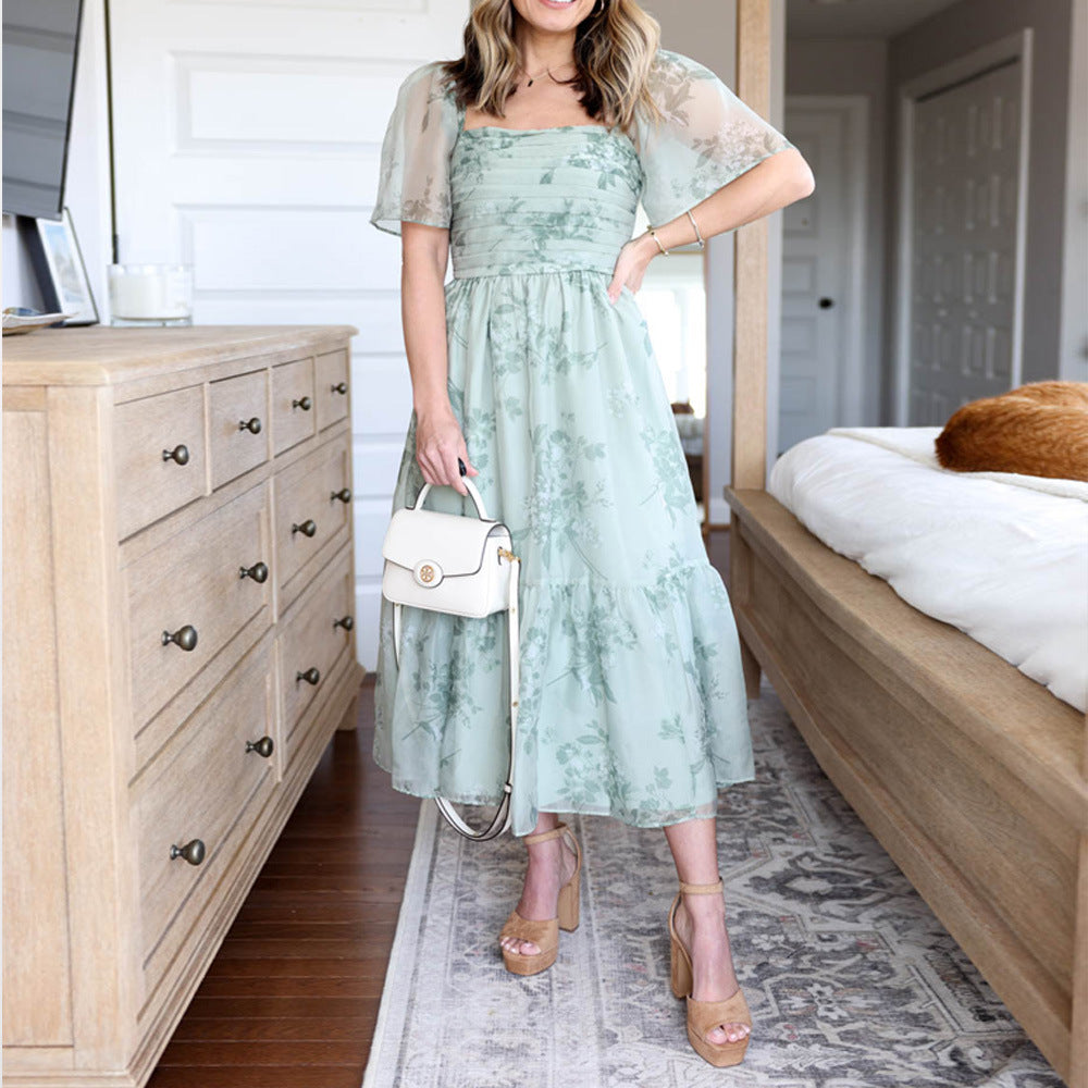 Dame Elegant blomsterkjole med gennemsigtige ærmer og taljering Stilla