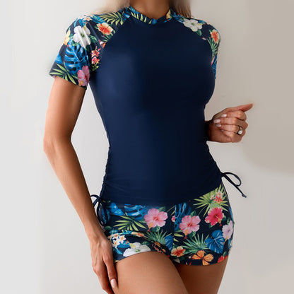 Dame Sporty Rashguard-sæt med blomsterdetaljer og elastiske shorts Stilla