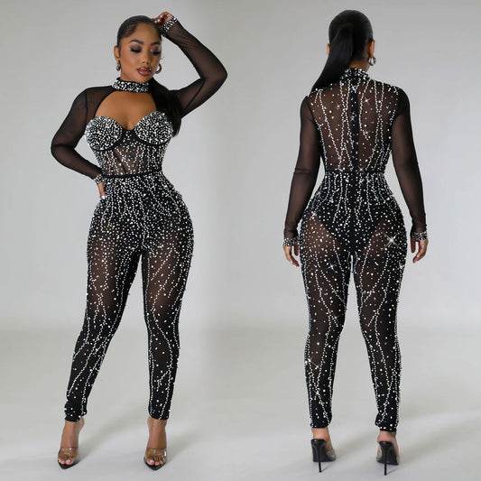Dame Glamourøs Jumpsuit med gennemsigtigt overmateriale og funklerende strassdekorationer Stilla