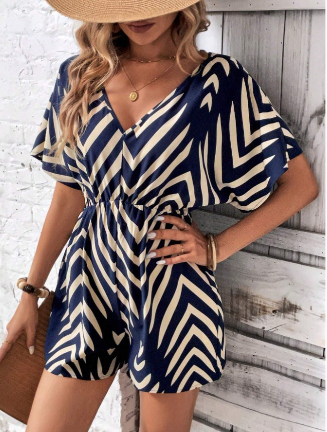 Dame moderigtig jumpsuit med omfattende indpakningslook og grafisk mønster Stilla