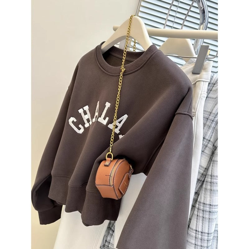 Dame Cropped Graphic Sweatshirt med distressed accenter Stilla