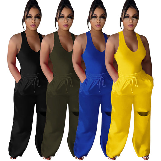 Dame sportlig jumpsuit med dyb V-udskæring og innovative lommer Stilla