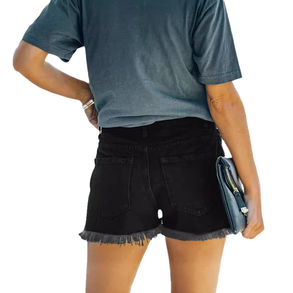 Dame afslappede Denim-shorts med moderigtige ripped-detaljer og Amerika-flags-elementer Stilla