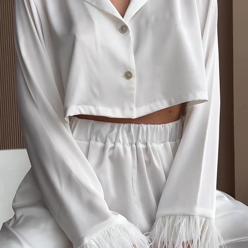 Dame Elegant cropped top og løstsiddende bukser med fjerdetaljer Stilla