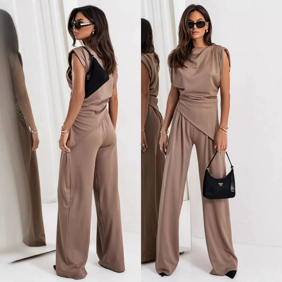 Dame jumpsuit med asymmetrisk design og bredt skårne bukser Stilla