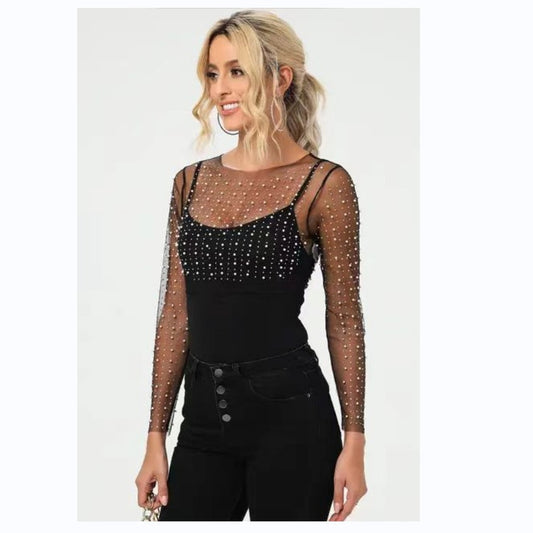 Dame elegant bodysuit med transparente ærmer og glitrende detaljer Stilla