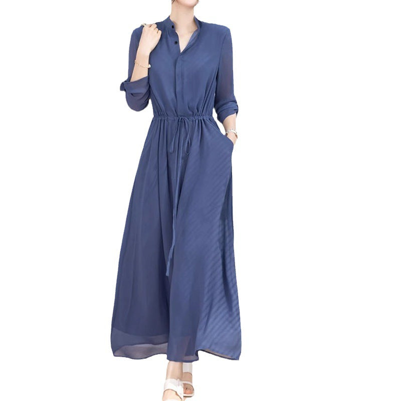 Dame stilfuld jumpsuit med elegant ståkrave og praktiske lommer Stilla