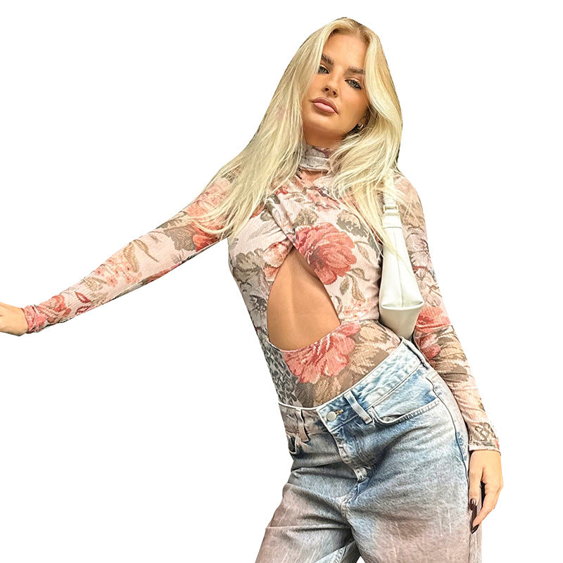 Dame jumpsuit med blomsterdesign og innovativ cut-out Stilla