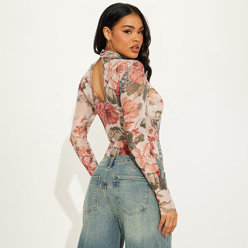 Dame jumpsuit med blomsterdesign og innovativ cut-out Stilla