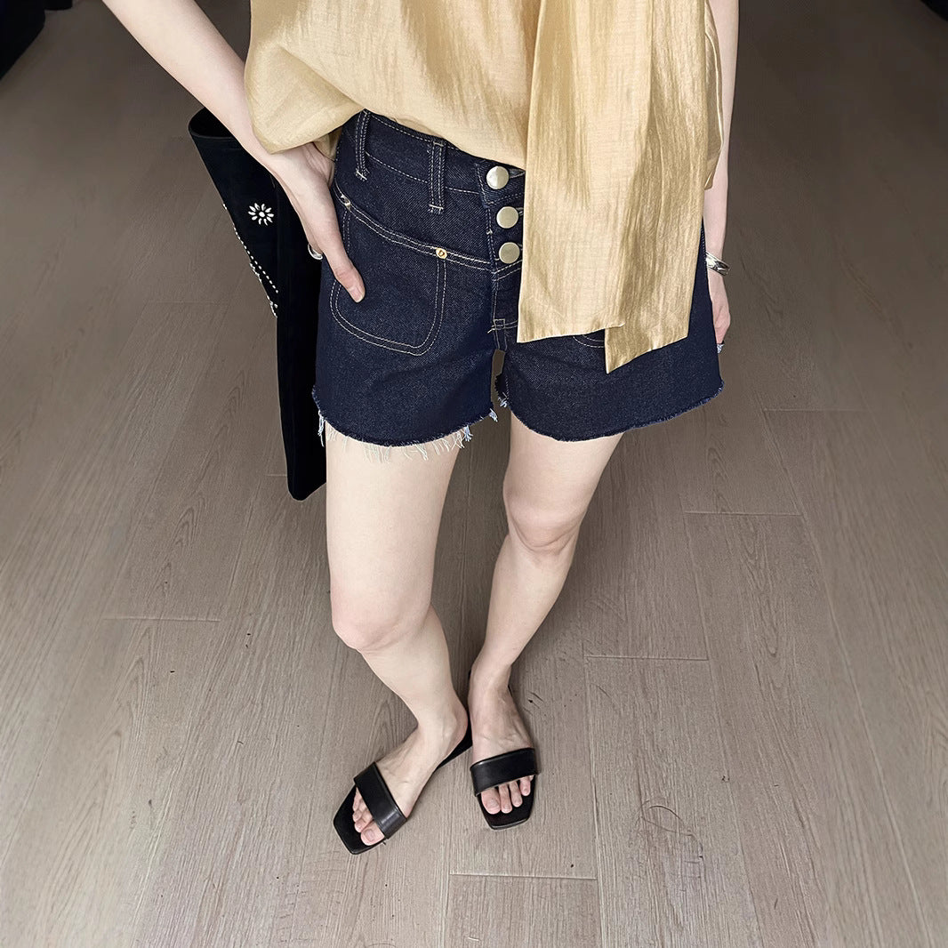 Dame Denim-shorts med knapdetalje og afslappet design Stilla