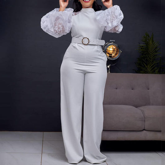 Dame jumpsuit med transparente puffærmer og taljerbar bælte Stilla