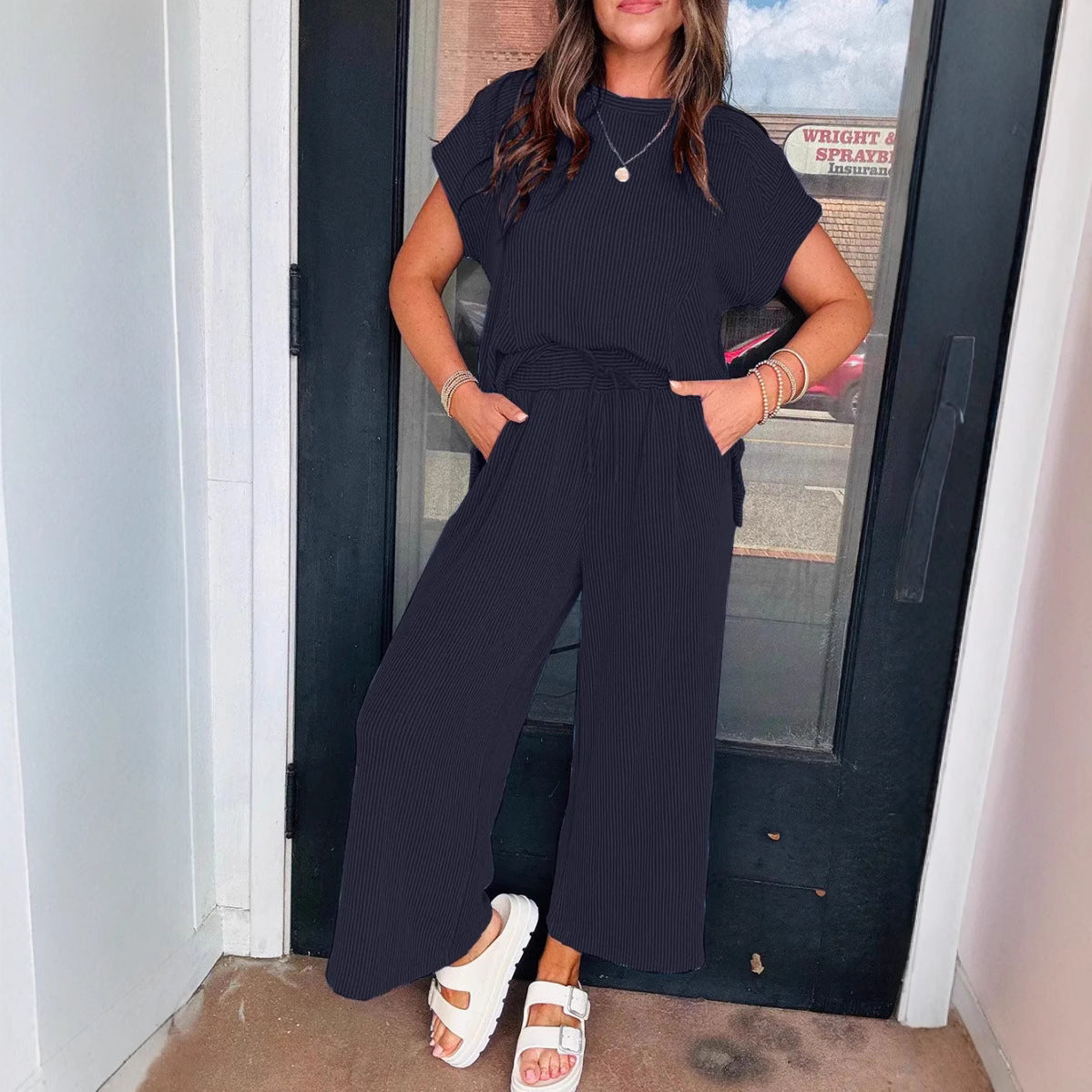 Dame afslappet strik-jumpsuit med brede ben og elastisk talje Stilla
