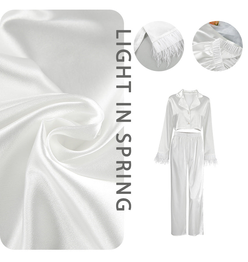 Dame Elegant cropped top og løstsiddende bukser med fjerdetaljer Stilla