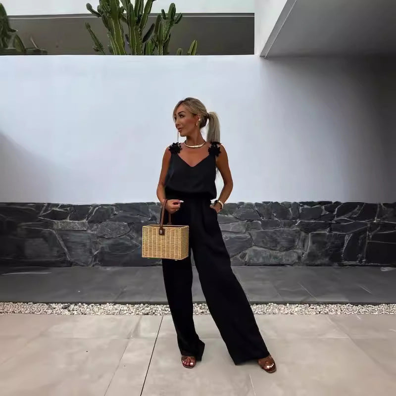 Dame løst skåret jumpsuit med floralt accent og elastisk talje Stilla