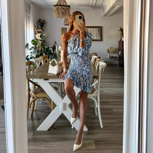 Dame jumpsuit med asymmetrisk udskæring og flæsedetaljer Stilla