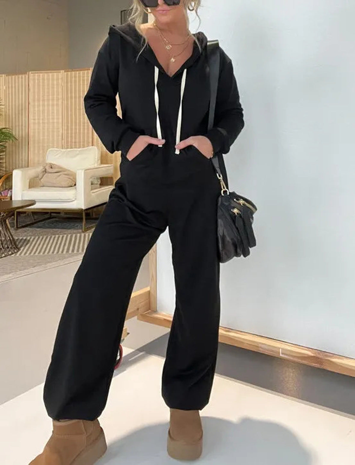 Dame hætte jumpsuit med afslappet snit og praktiske lommer Stilla