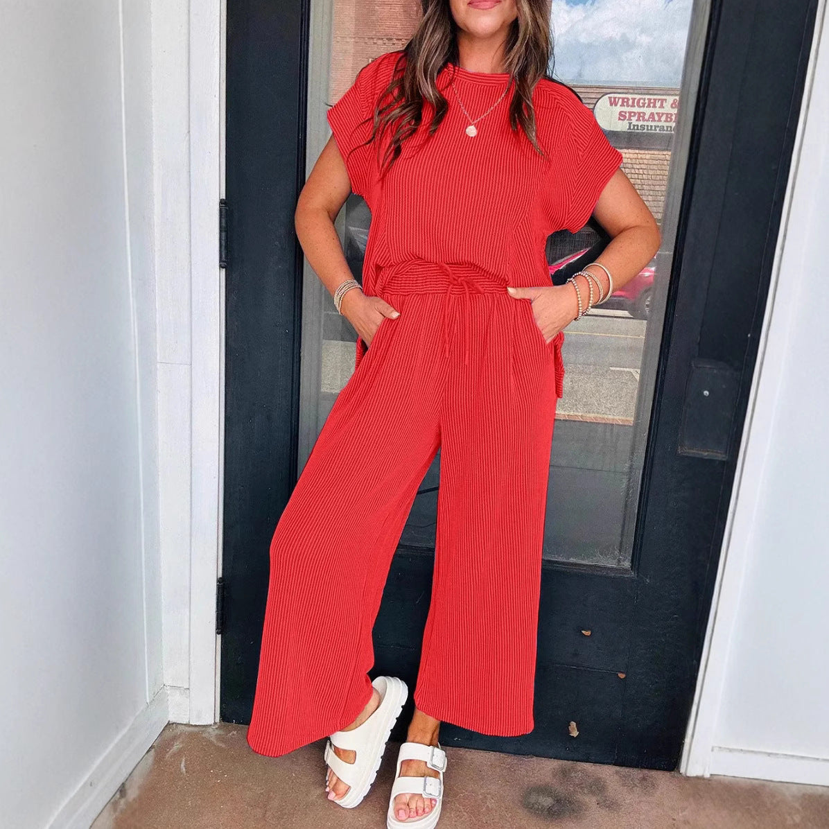 Dame afslappet strik-jumpsuit med brede ben og elastisk talje Stilla