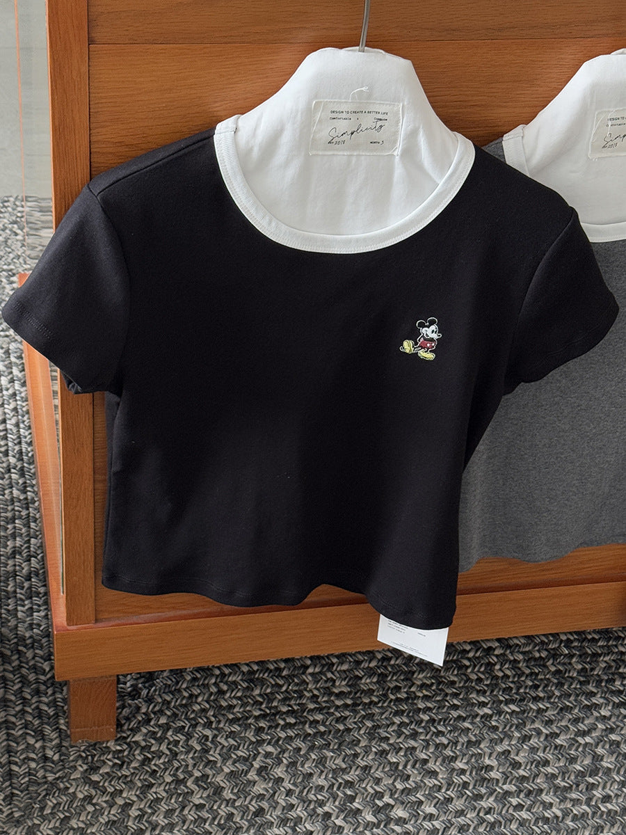 Dame afslappet kortærmet top med kontrasterende halsudskæring og stilfuld snit Stilla