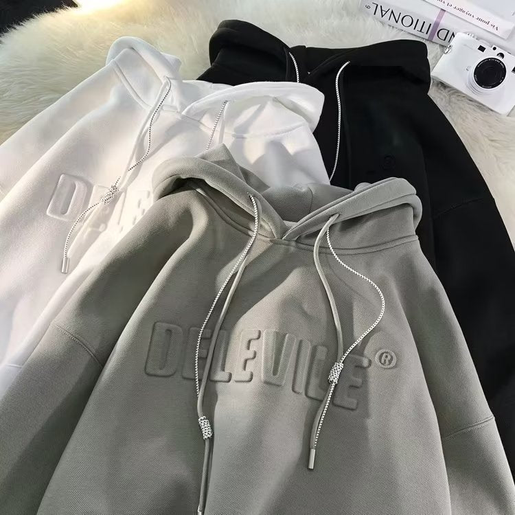 Dame Cozy Hættebluse med struktureret overflade og stilfuldt frontlogo Stilla
