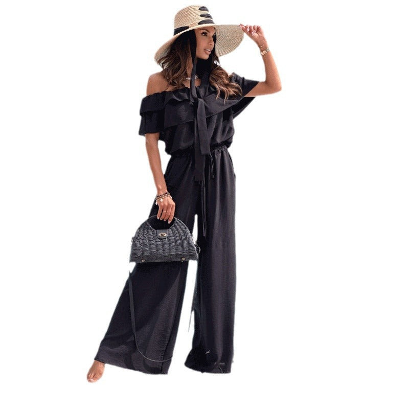 Dame elegant jumpsuit med off-shoulder udskæring og flydende snit Stilla
