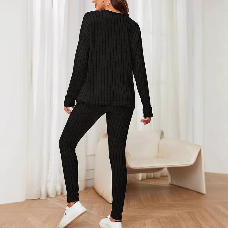Dame afslappet langærmet top med praktisk lommefunktion og matchende leggings Stilla