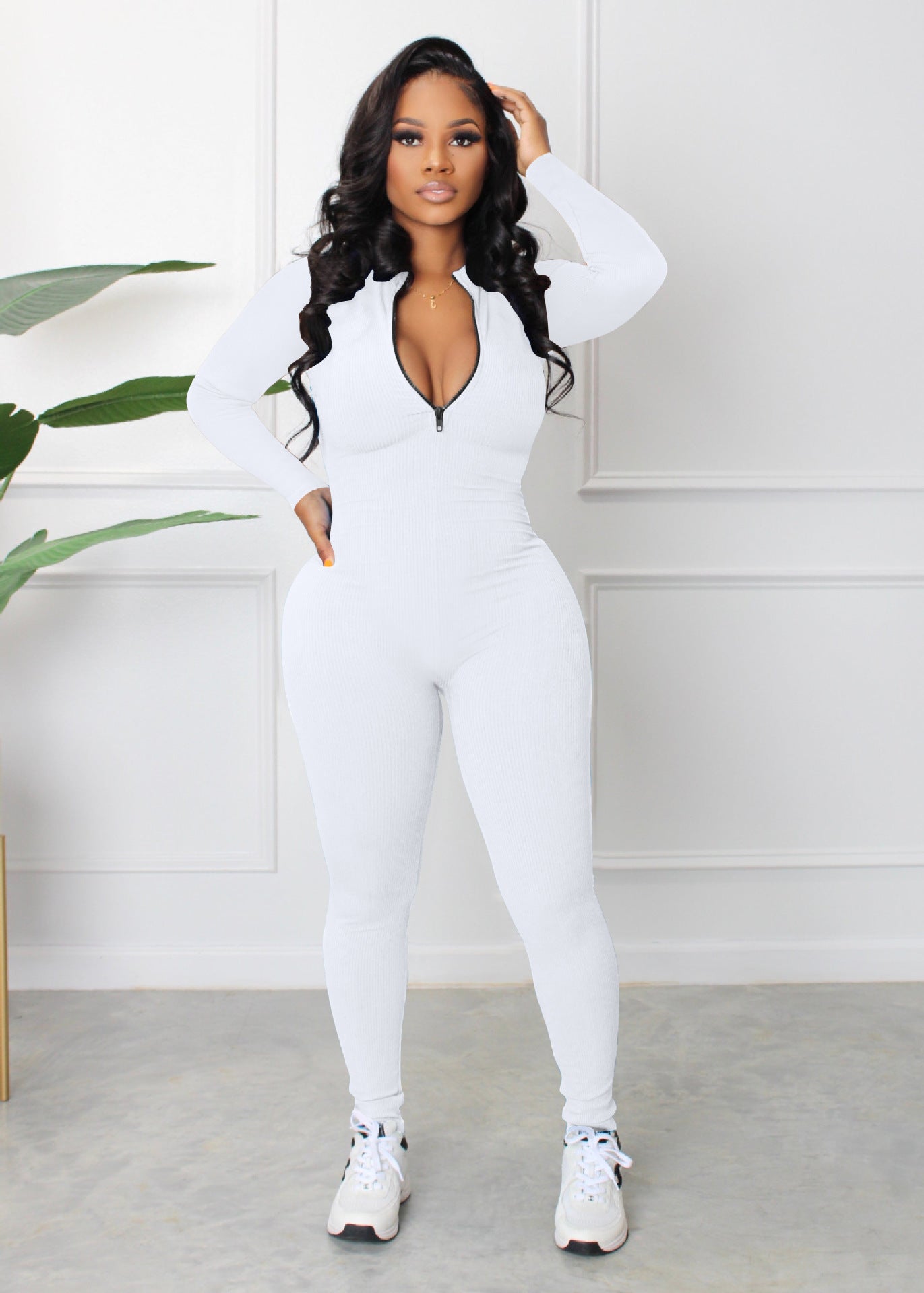 Dame sporty langærmet jumpsuit med lynlås og tætsiddende snit Stilla