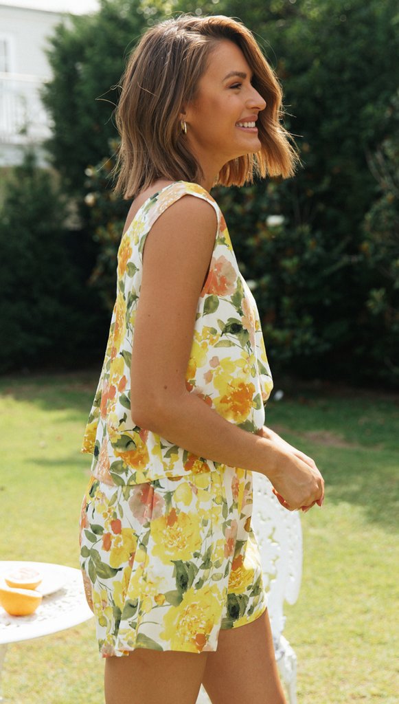 Dame jumpsuit i blomsterdesign med dyb V-udskæring og elastisk bund Stilla