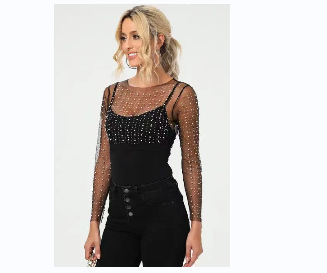 Dame elegant bodysuit med transparente ærmer og glitrende detaljer Stilla