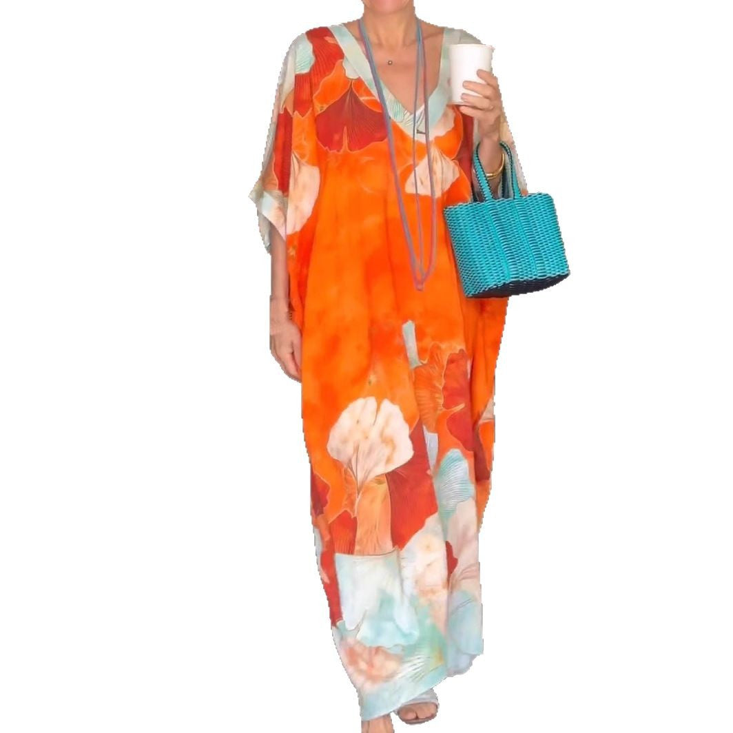 Dame Elegant kaftan-kjole med blomsterdesign og brede ærmer Stilla