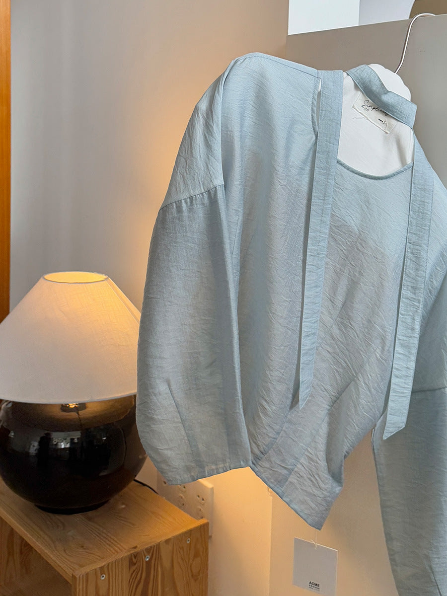 Dame afslappet indpakningsoverdel med elegant design og taljerbar bælte Stilla