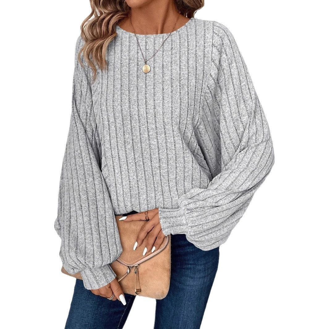 Dame sweater med elegante ballonærmer og ribbestruktur Stilla