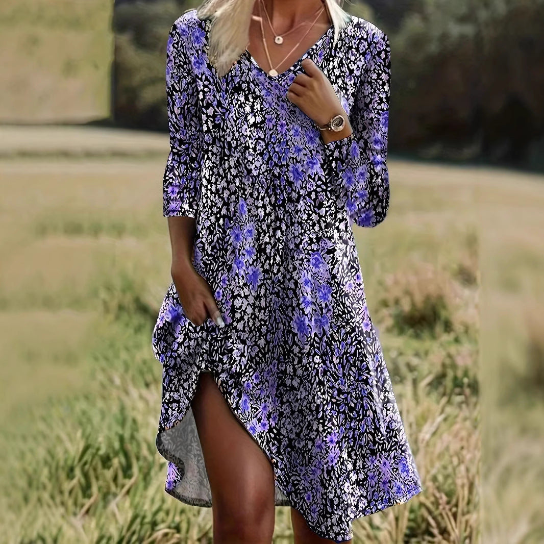 Dame afslappet midikjole med blomsterprint og asymmetrisk kant Stilla