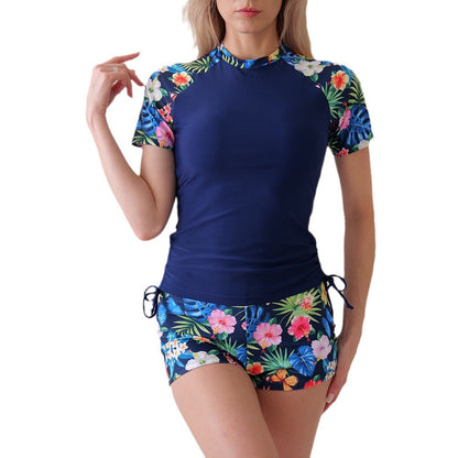 Dame UV-beskyttelsestop med farverigt blomstertryck og shorts Stilla