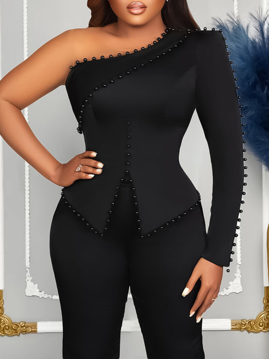 Dame jumpsuit med asymmetrisk design og dekorative elementer Stilla