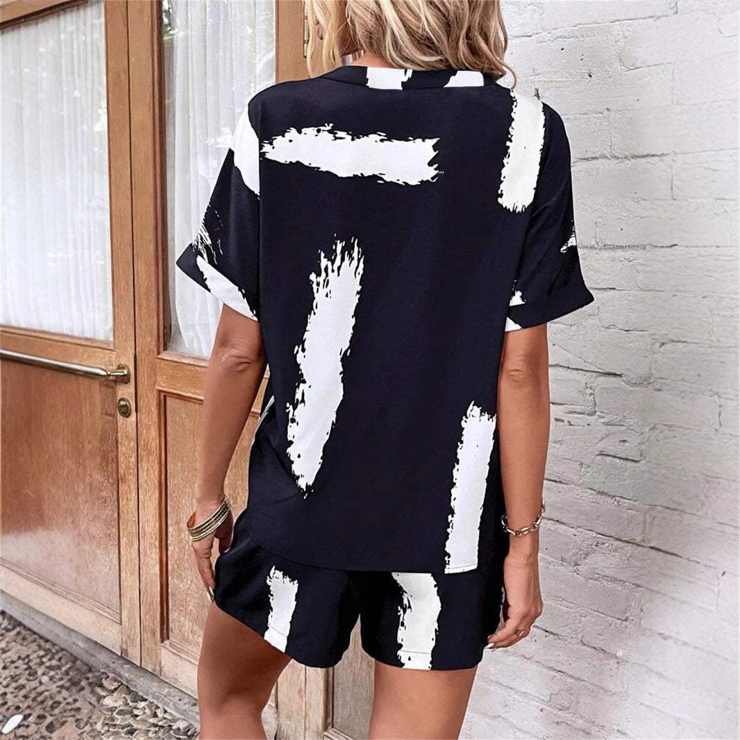 Damer kortærmet jumpsuit med moderne grafiktryk Stilla