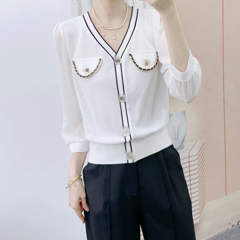 Dame elegant bluse med transparente ærmer og dekorative knapdetaljer Stilla