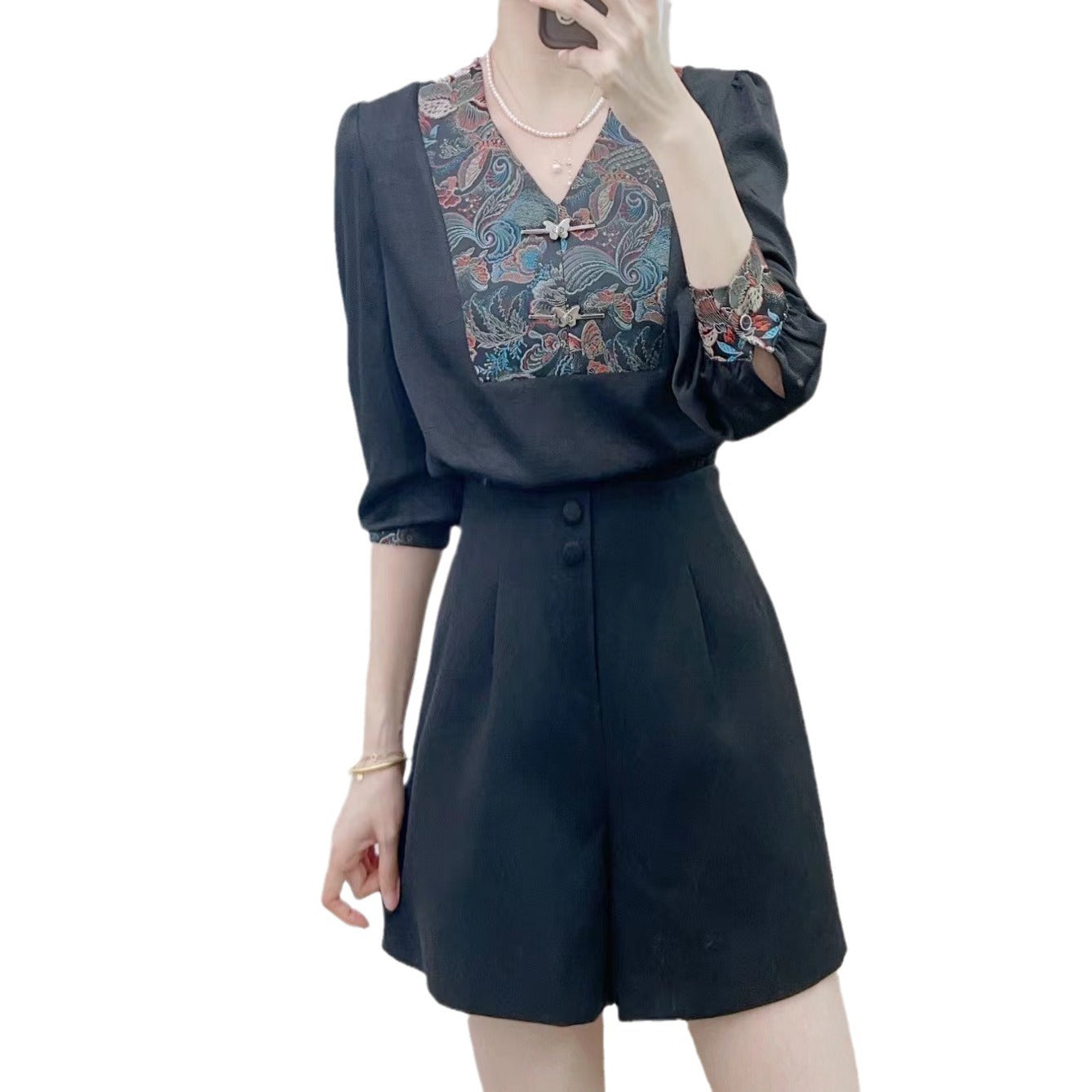 Dame Elegant Bluse med blomstret design og feminine pufærmer Stilla