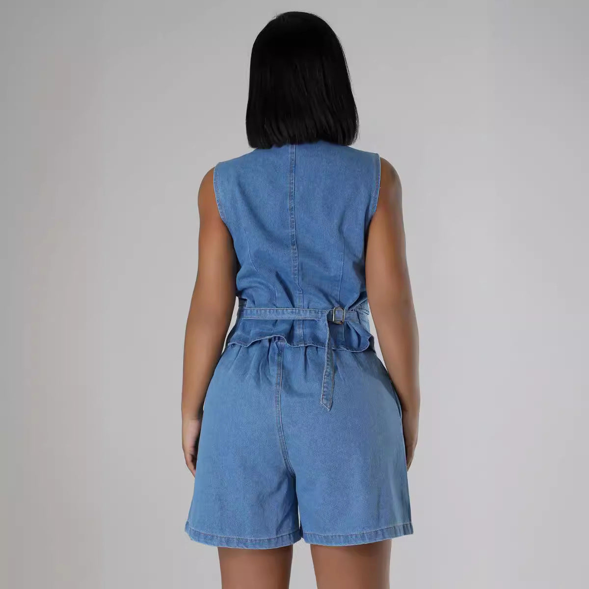 Dame Denim- jumpsuit med tætsiddende pasform og knapdesign Stilla