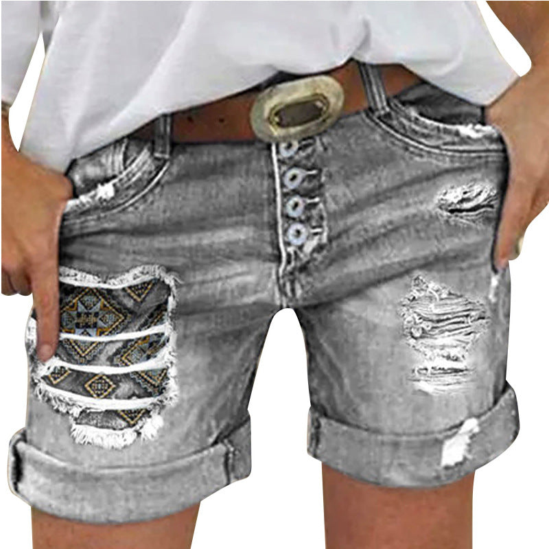 Dame denim-shorts med moderne ripped-design og farverige indlæg Stilla